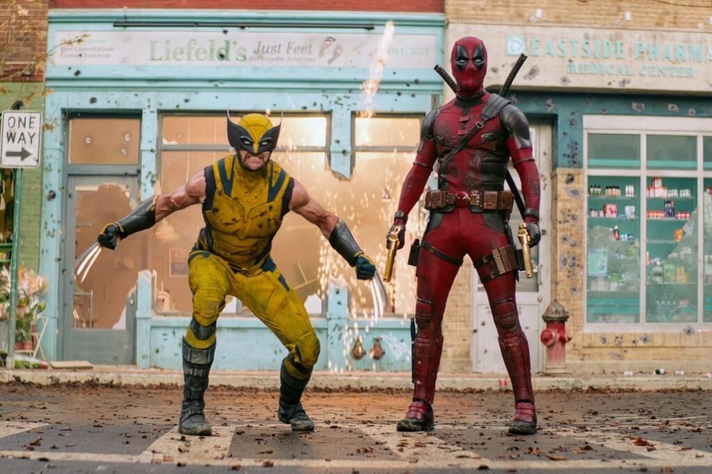 Deadpool MCU Origin, Powers & Phase 6 Future: The Ultimate TheMultiverseReel Fan Guide Ryan Reynolds as Deadpool standing alongside Hugh Jackman as Wolverine in Deadpool & Wolverine